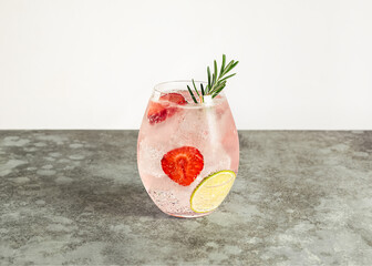 Strawberry and rosemary pink gin cocktail, refreshing alcohol drink