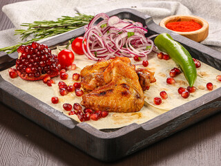 Chicken witngs barbecue served onion