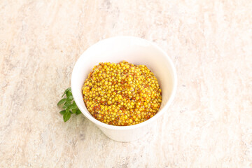Grain mustard sauce in the bowl