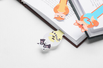 Cute bookmarks with books on white background