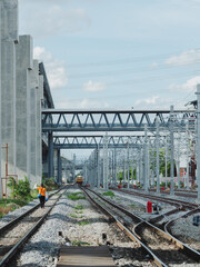 Fototapeta premium Freight Train with Cargo Containers at Bangkok Railway Station is the main railway station in Bangkok and Railway station to across the country. background is building downtown. 