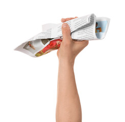 Male hand and crumpled newspaper on white background