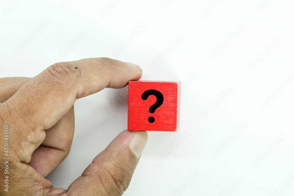 Aufkleber a hand holding a red cube with a question mark icon