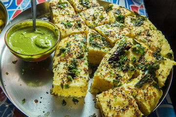 Khaman dhokla - a traditional gujrati Indian food served as breakfast or brunch prepared with gram...