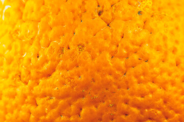 Close up photo of orange peel texture. Oranges ripe fruit background, macro view. .Human skin...