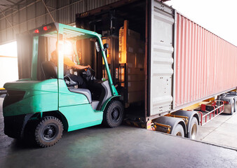 Forklift Tractor Loading Package Boxes into Cargo Container at Dock Warehouse. Delivery Service....