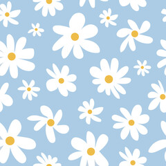 Vector hand drown camomiles seamless pattern on a soft blue background