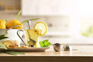 Green tea with ginger and lemon on table in kitchen