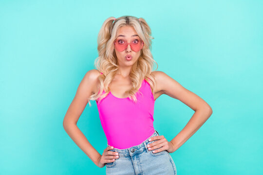 Portrait of attractive amazed funky wavy-haired girl posing oops pout lips isolated over vivid teal turquoise color background