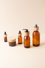 Composition with skin care products on pastel beige background. Close up, copy space