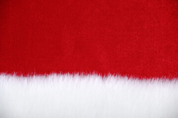 Christmas natural background made of velvet fabric, white fur at the bottom(imitation of Santa Claus costume details) for the design of New Year greeting cards, invitations,banners.Space for the text.