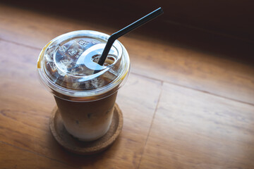 coffee iced on wooden table brown tube