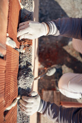 Real construction worker working on a house renovation - authentic person on the job.