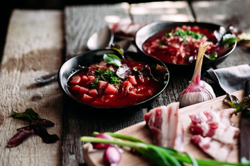Ukrainian red borscht in a black plate
