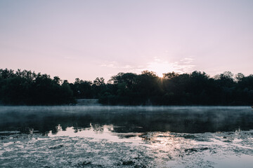 Sunrise and fog over the lake