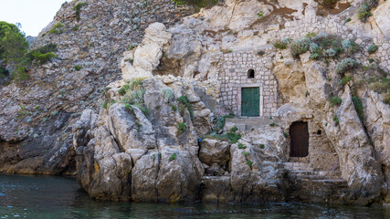 Rocks in Dubrovnik with mysterious door