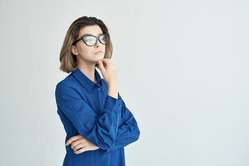 woman in blue shirt wearing glasses cropped view elegant style