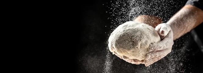Badkamer foto achterwand Hands of baker kneading dough isolated on black background. prepares ecologically natural pastries © Надія Коваль