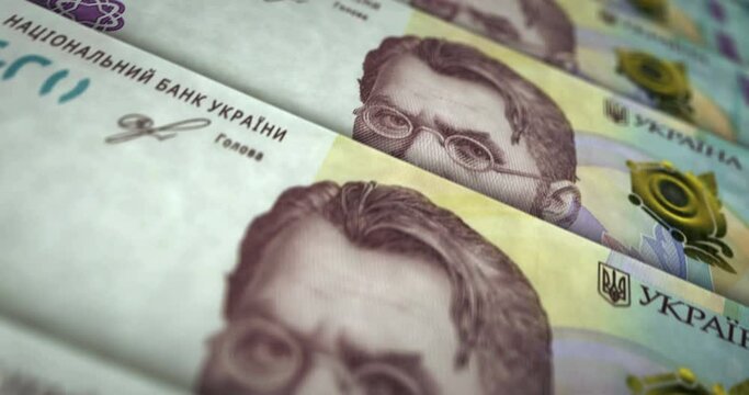 Ukrainian Hryvnia money counting machine with banknotes. Quick 1000 UAH currency note down rotation. Business and economy in Ukraine concept loopable and seamless background.