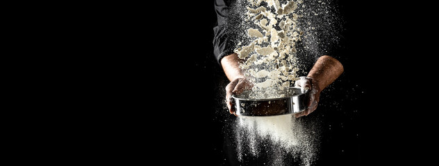 Clap hands of baker with flour. Beautiful and strong men's hands knead the dough make bread, pasta...
