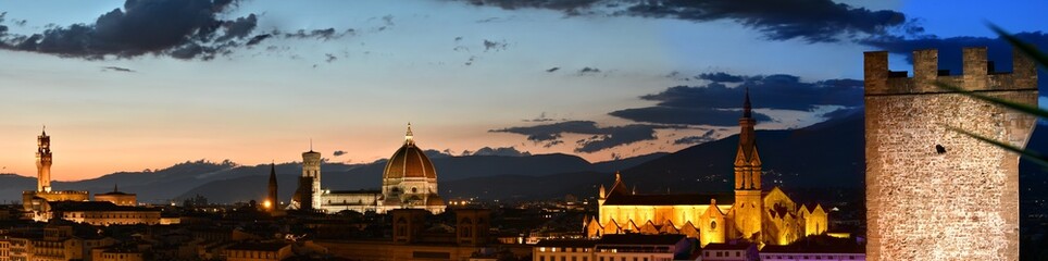 Florence, July 2021: Spectacular cityscape by night of Florence with Palace of the Town Hall, Cathedral of Santa Maria del Fiore and Basilica of the Holy Cross  seen from Piazzale Michelangelo. Italy