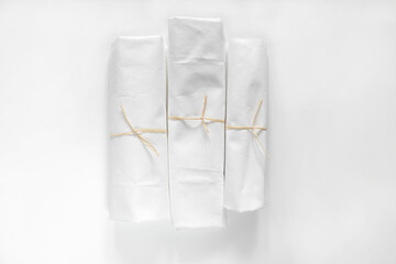 White cotton Fabric Rolls Mockup. Pieces of textile tied with rope