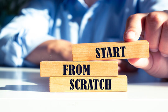 Start from scratch - phrase from wooden blocks with letters, start from the very beginning concept