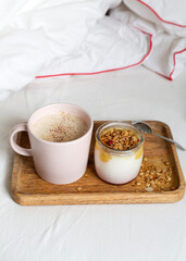 breakfast. yogurt with granola, cappuccino