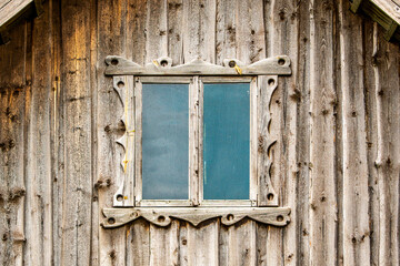 Wooden window of old log house