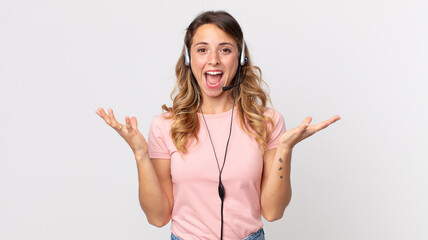 pretty thin woman feeling happy and astonished at something unbelievable .operator assistant  with...