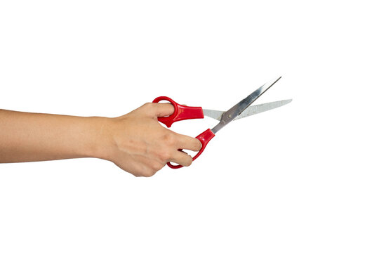 Close up of hand cutting using scissors isolated with white background