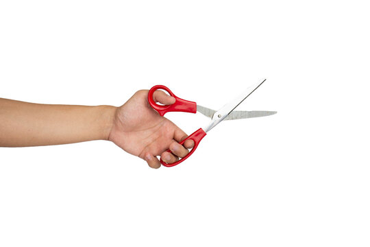 Close up of hand cutting using scissors isolated with white background