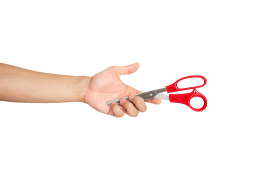 Close up of hand holding scissors isolated with white background
