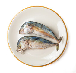 2 mackerel on a plate isolated on a white background, Mackerel is a small fish that is popular for cooking, mackerel meat has many nutrients. Both linoleic acid and cocosahecinoic acid (DHA).