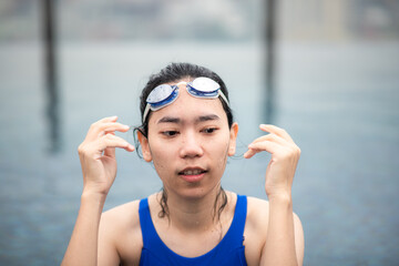 young sport woman person swimming in water pool, healthy female people in blue swimwear with athlete lifestyle, underwater active fitness competition girl with goggles in swimming pool