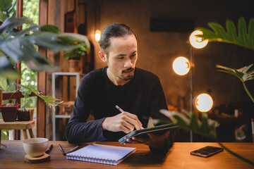 using professional digital tablet technology to write a business work, modern online screen cyberspace communication, hand writing via white pen, lifestyle same laptop computer or notebook using