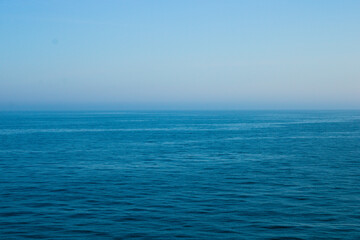 Calm Irish sea in the morning with mist in the background, seascape