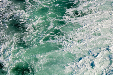 Fototapeta na wymiar Rippled water behind boat in Irish sea