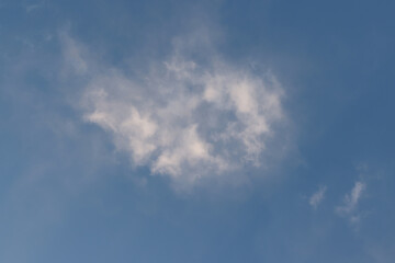 Bright white clouds over blue sky