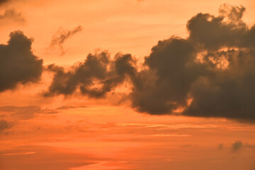 Dramatic brightly lit orange sunset cloudscape