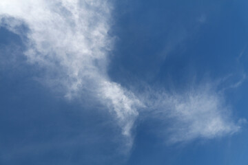 Bright white clouds over blue sky