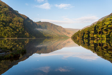 Tranquil summer morning at the Glendalough Upper Lake in Wicklow Mountains, Ireland, with lovely...