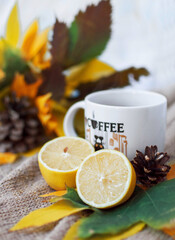 a cup of tea with lemon and autumn