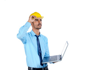 young Indian engineer in uniform and using laptop on white background.