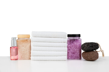 Spa still life with stacked of stone and towel isolated on white