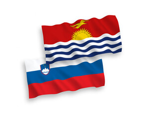 National vector fabric wave flags of Slovenia and Republic of Kiribati isolated on white background. 1 to 2 proportion.