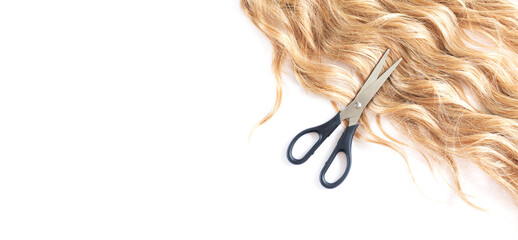 Banner of beautiful blond hair and hairdresser scissors top view