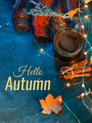A mug of fragrant coffee, a colorful autumn scarf, the composition hello autumn top view © pavelkant
