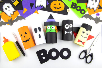 Craft with a child for Halloween from rolls of toilet paper and colored paper. Step-by-step instructions for ready-made crafts.