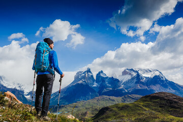 Traveler with Backpack hiking in the Mountains. Travel sport lifestyle concept. Patagonia. Chile